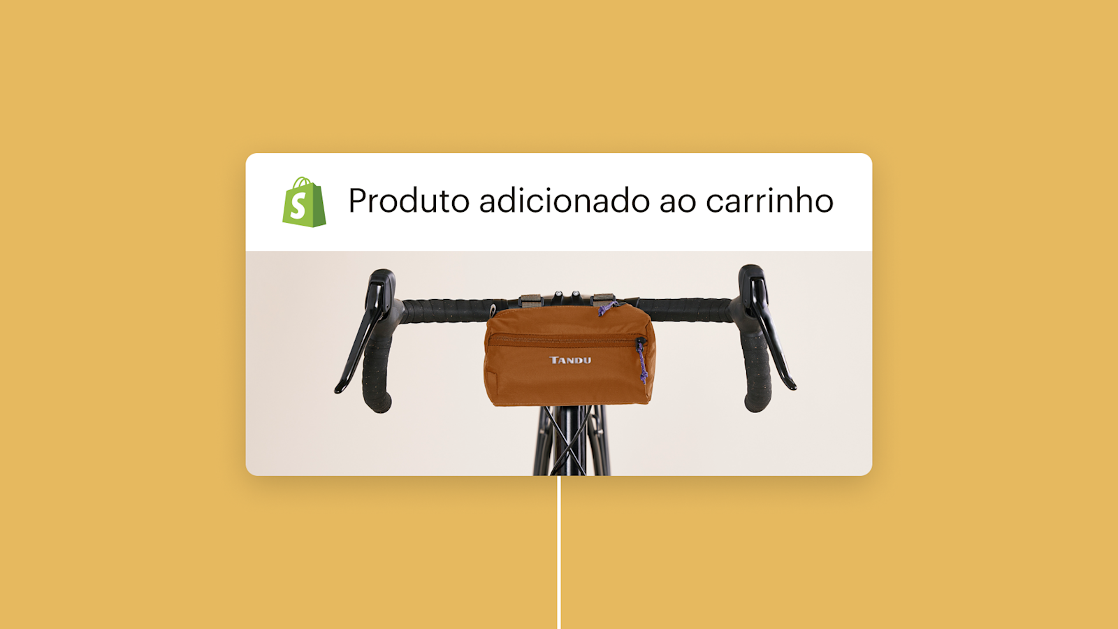 Bolsa de guidão marrom montada em guidão de bicicleta preto com logotipo da Shopify e texto "Produto adicionado ao carrinho" acima